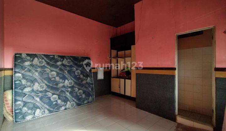 Cheap house, spacious land in Kampial Dharmawangsa, view of the Gwk statue 2