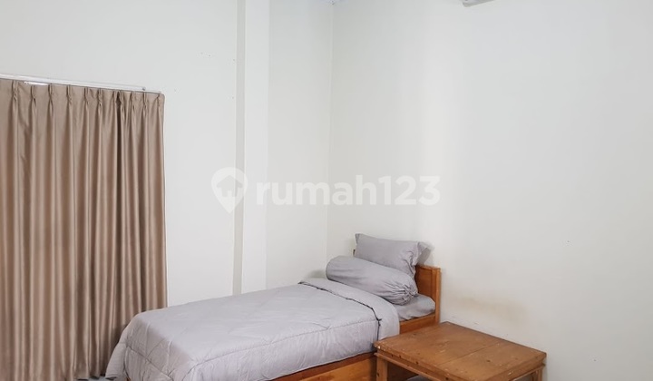 Kost2 a 2-story building in Beji, Depok, West Java, near UI Campus and KRL Station. 2