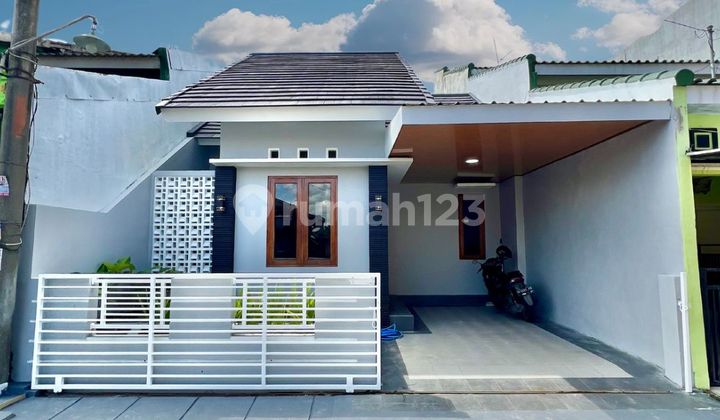 House in the Griya Taman Asri Housing Complex House in the Griya Taman Asri Housing Complex