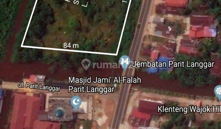 Tanah Tepi Jalan Wajok 9.090m2 1