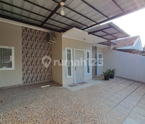 Rumah Siap Huni, Renovasi, 1,25 Lantai, Utara, di Perum Griya Loka BSD 2