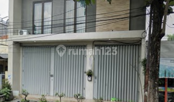 Shop house for sale on Raya Dukuh Kupang Surabaya, strategic and bustling.