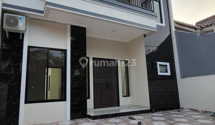 Rumah baru minimalis modern 2 lantai Depan Taman di Melati Mas 1