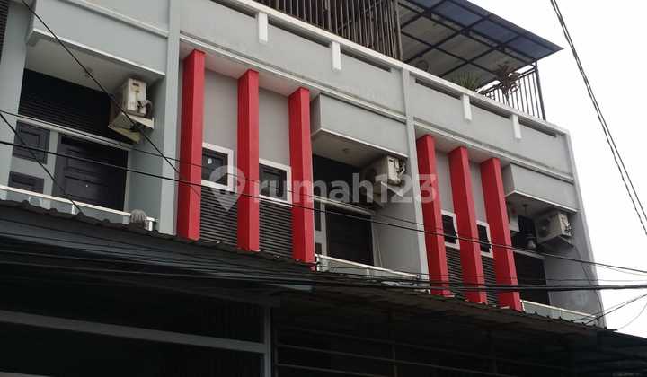 2-Storey Red-Grey House in Jelambar Grogol, West Jakarta 2