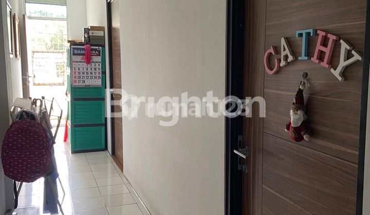 Ruko Green Garden Jl Panjang (Note: "Ruko" is a common term in Indonesia for a shop house, combining retail space on the ground floor and residential space above. "Jl" is short for "Jalan," meaning "Street" in English. A direct translation would be "Green Garden Shop House, Panjang Street," but it's often left as is in English contexts for localization purposes.) 2