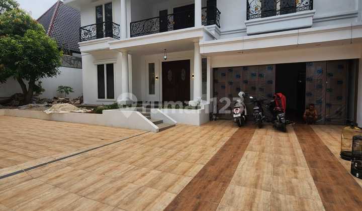 Affordable Luxury House For Sale in Cilandak, South Jakarta, South Facing, Swimming Pool, Front and Back Garden, Near Mall, Near Tb Simatupang Toll Gate, Quiet Neighborhood, and Flood-Free.