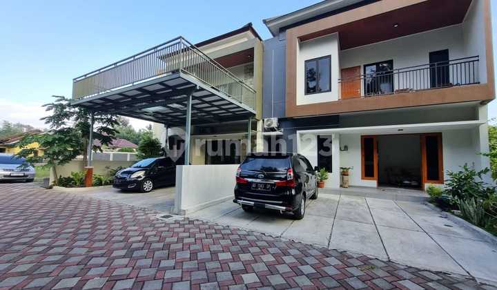 Two-story house with swimming pool, strategically located near UII campus.