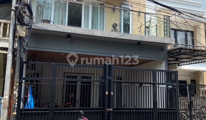 Rumah Minimalis bagus, rapih siap huni di Taman Surya 0011.erwher