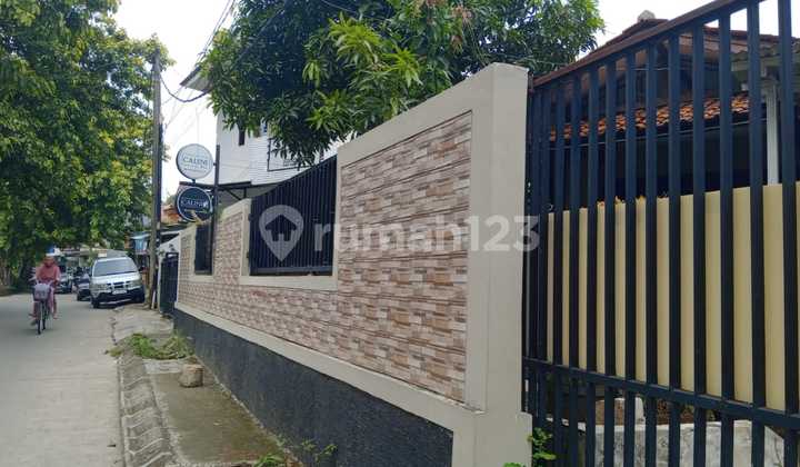 For Sale: A cool house with a spacious yard by the main road. 2