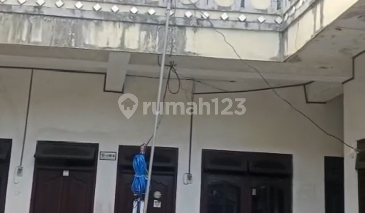 Text: Ready to Occupy Boarding House with 15 Rooms in Kuta Near Airport Bg/Jess 2