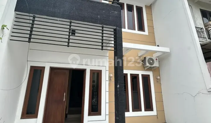 Affordable 2-Story Minimalist House Semi-Furnished Ready to Live Near Gwalk at Villa Sentra Raya Citraland Utama West Surabaya