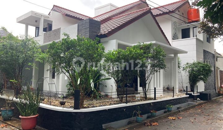 1-Story House in Front of Tennis Court