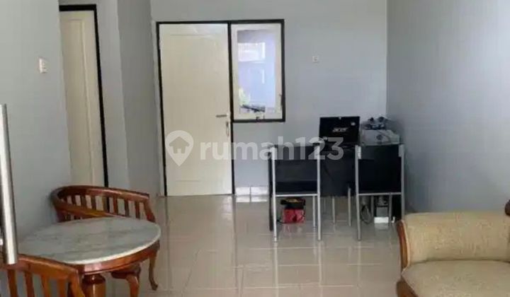 Rumah Minimalis Dekat Taman di Graha Raya 2