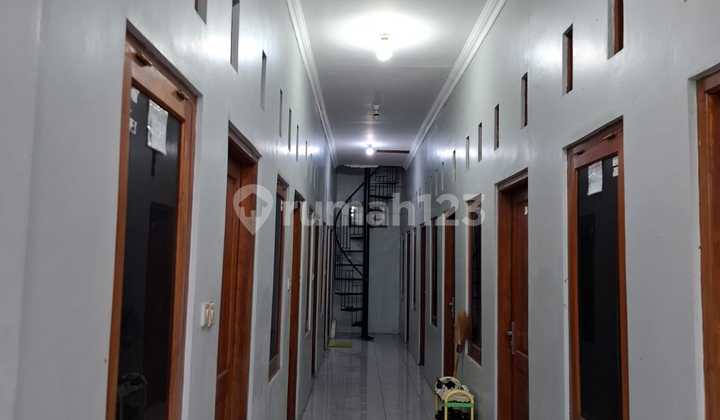 Active 12-room boarding house near malls in Solo Baru, ideal for investment.