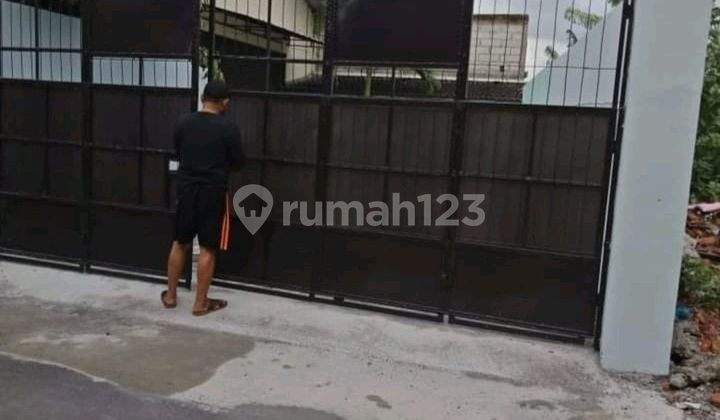 Warehouse on the Side of the Highway 1