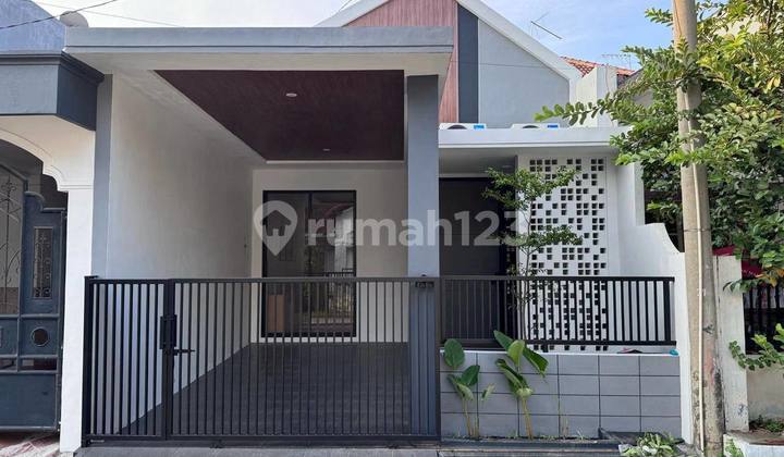 Beautiful House in Griya Asri, Pakuwon City, Modern Compact House Concept