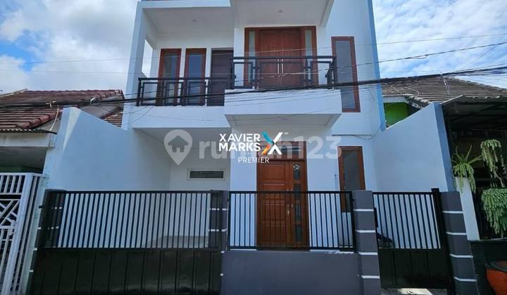 2-Story House in Ikan Ikan Street Housing, Blimbing, Malang 1
