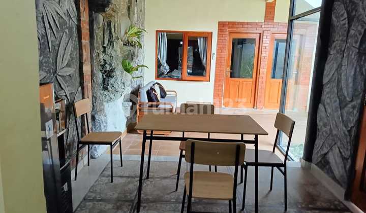 Rumah Minimalis Semi Villa dengan Taman yang Asri 2