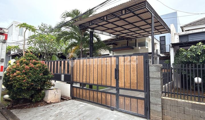 Minimalist House with a Spacious Garden at Cibubur Country Boulevard by the Roadside. 1