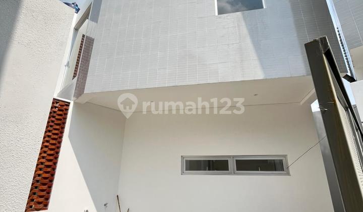 Modern New House Cibabat Cimahi 2 Floors Elegant Glass Facade 2