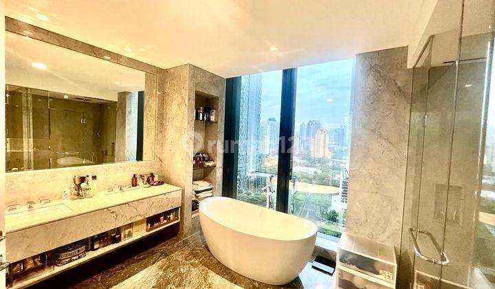 Apartement  Penthouse Mewah The Langham dikawasan SCBD Senayan, Large living room access to balcony
,Dinning area with wine/ liquer rack display,wood wall moulding in main area
, Dry kitchen with island
Subzero refrigerator & wolf kitchen appliances
 2