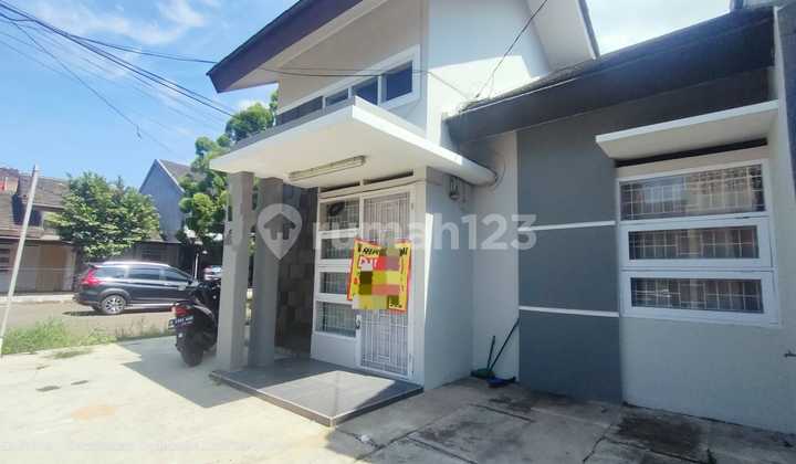 minimalist house facing public facilities, plot size 119/55, price 888 million in Soetta cluster 2