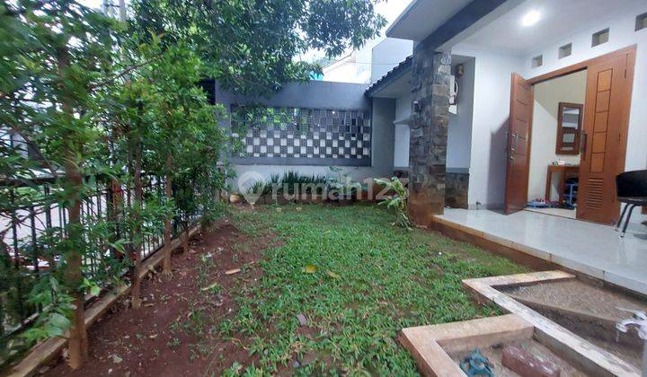 Rumah 1,5 lantai, siap huni, bebas banjir di Permata puri Laguna Cimanggis Depok 1