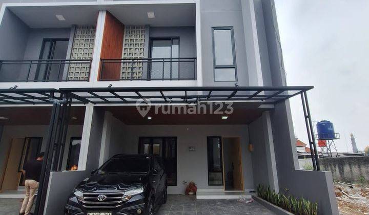 Dijual rumah siap huni bebas biaya biaya model scandinavian dengan material premium dengan design elegant cocok untuk pasangan muda samping masjid kubah emas udara masih segar lingkungan asri lokasi mudah di akses deket ke toll sawangan dan toll limo aman 2