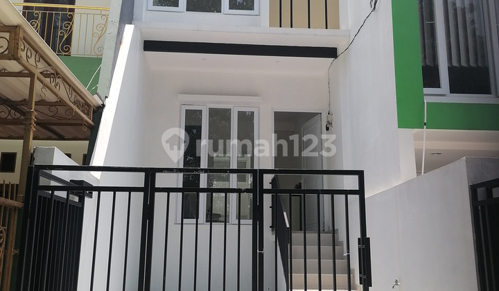 0405JA NEW 2-Story House, Wide Road Fits 2 Cars, Rp1.3m Slightly Negotiable, Neat & Clean. Contact for Property Sales, Purchases, Rentals. WhatsApp Antolukas at 0813 1535 7990.