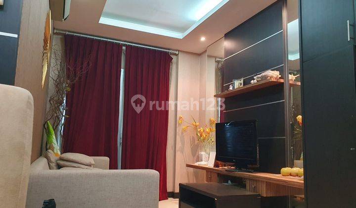 Disewakan Apartemen Cosmo Mansion 2 Bedroom Lantai Tinggi Furnished 1