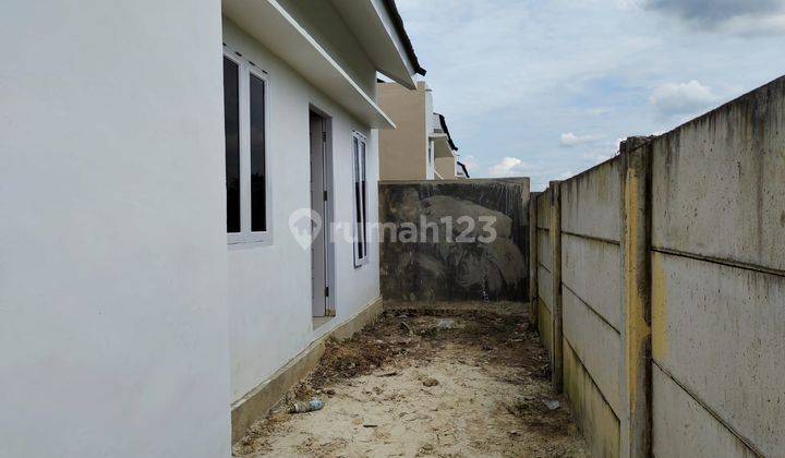 Rumah cantik di dekat bandara SSK simpang tiga 13