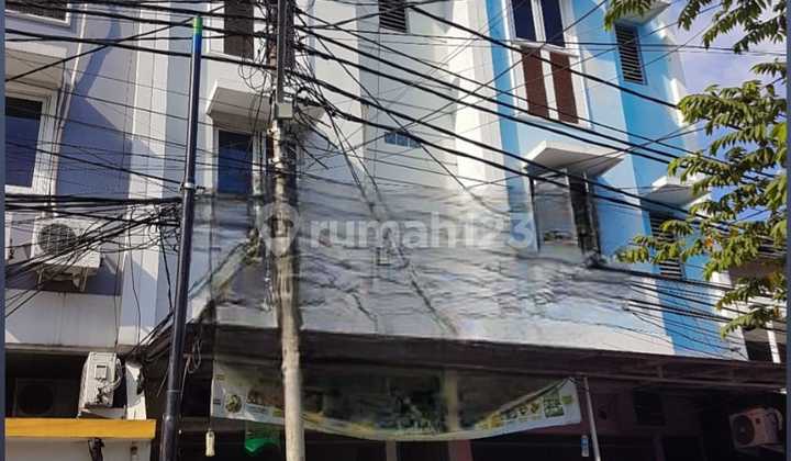 1253 Kos + business Tomang