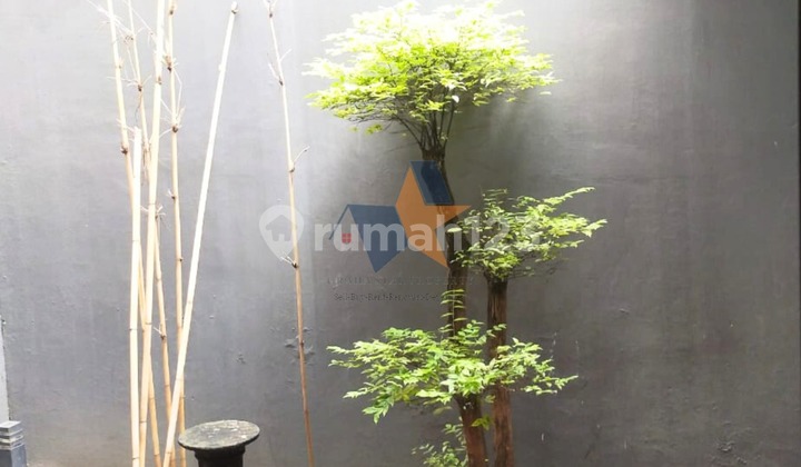 QUICK Sale Beautiful 2-Story House in Lush, Flood-Free Area - Graha Raya Bintaro