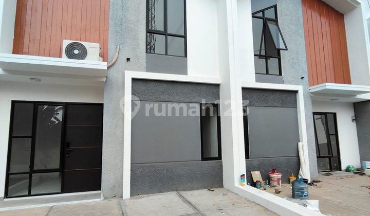 Rumah Modern 1,5 Lantai Konsep Mezzanine di Pondok Cabe Tangsel.