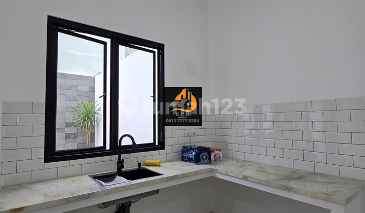 T27. Minimalist Modern House in a Complex with a Spacious Yard in Duren Sawit 2