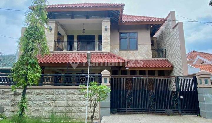 Second-hand house in Rungkut Asri Barat, 2 floors, width 15, with garage.