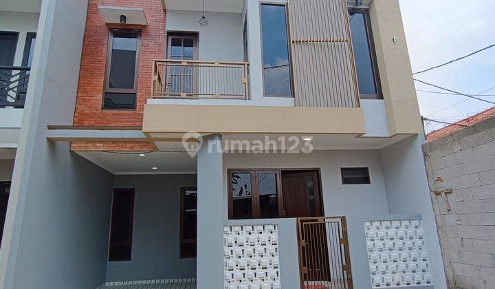 Di Jual Rumah 2 lt Siap Huni nempel sekolah Elit dalam Komplek 3 menit dari Toll Depok 1