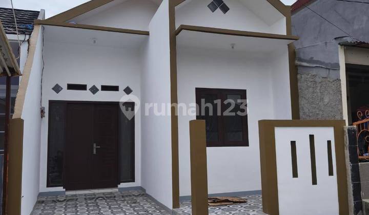 Rumah Coklat dalam Cluster cendrawasih pondok ungu permai 2