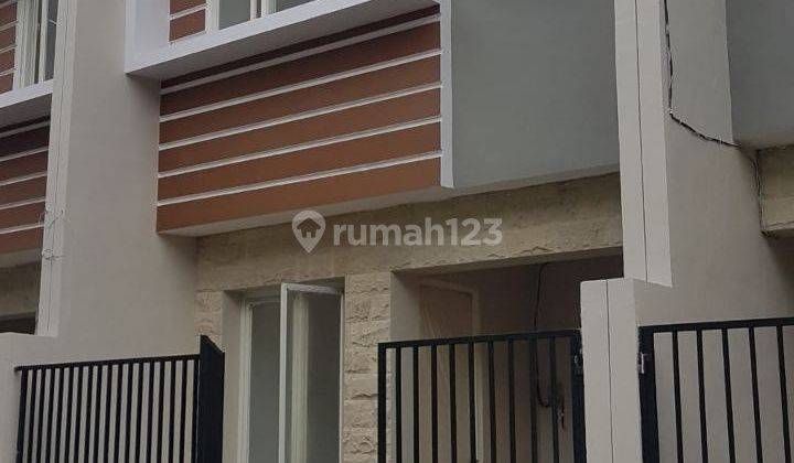 Rumah Regency One Kapas Madya MINIMALIS SIAP HUNI carport 1