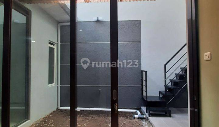 Rumah 1,25 Lantai Bagus Lebar Minimalis Sudah Renovasi, Taman Holis Indah 2