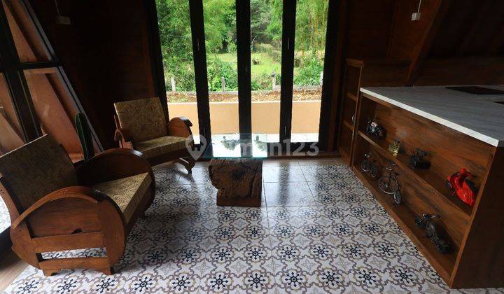 Rumah villa kayu vintage baru di Puncak Bogor, jaminan kualitas kayu 20tahun. Sudah SHM, IMB. Fasilitas kolam renang dan kolam ikan pribadi tiap. Cluster one gate system. Lokasi dekat jalan alternatif ke Taman Safari Bogor.Tersedia taman dan sungai kecil  13