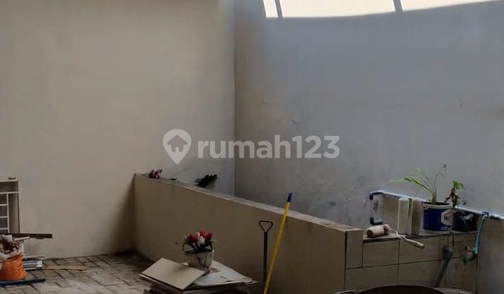 Three-story shop house on Holis main road.