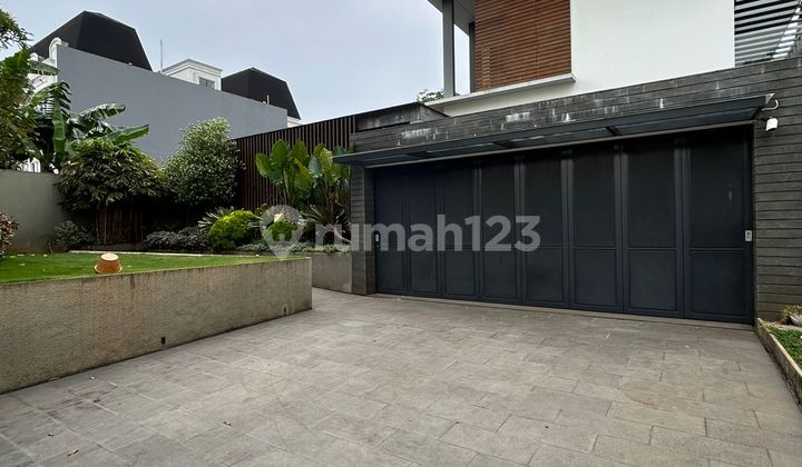 For sale luxury house at Paramount Hill Golf Gading Serpong, golf view position, fully furnished and well-maintained, with a swimming pool and fish pond.