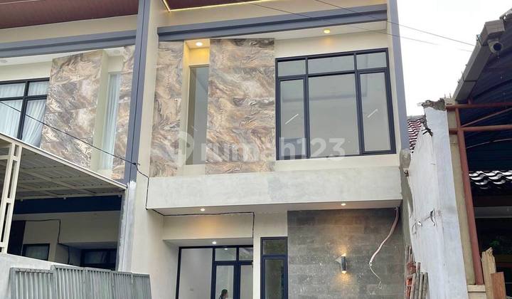 New Two-Story Rungkut Mapan House with Backyard and Laundry Area