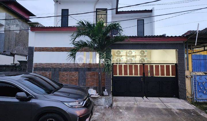 Dijual butuh uang banget kost 19 kamar full furnished jalan raya Jababeka