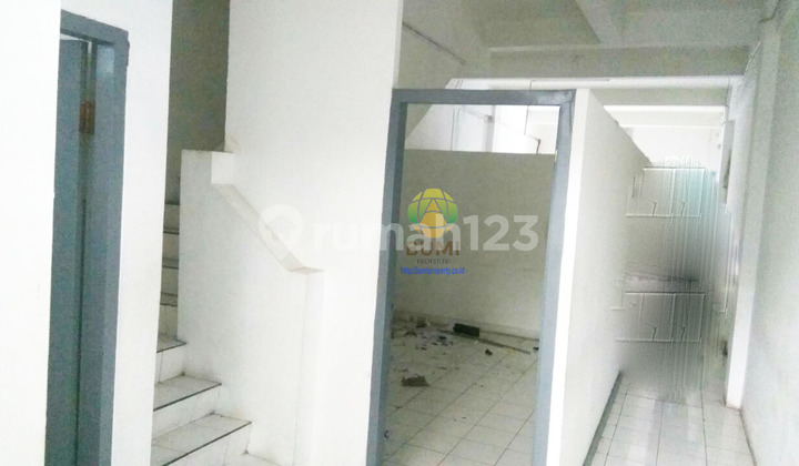 Two-story shop house in a busy location in downtown Solo.