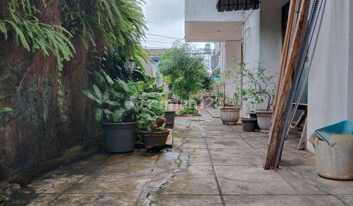 RUMAH LAMA HITUNG TANAH PINGGIR JALAN RAYA