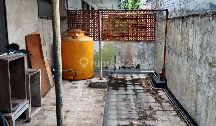 RUMAH LAMA HITUNG TANAH PINGGIR JALAN RAYA