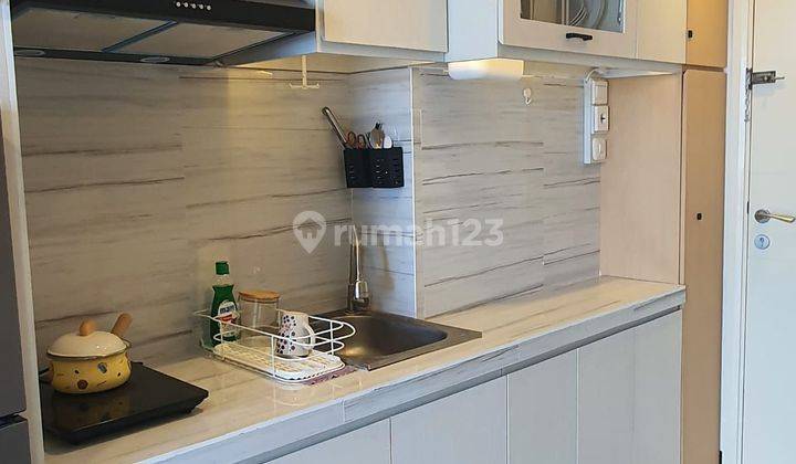 Apartemen Amor Pakuwon City Furnished Bagus 1