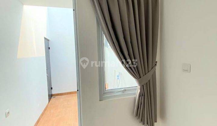 Rumah Hoek Row Jalan Depan Lebar Semi Furnished Di Sawangan 2